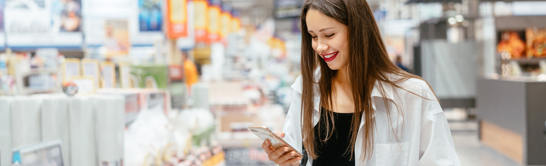 Woman in diy store with smartphone Industrial & Consumer Elektronics